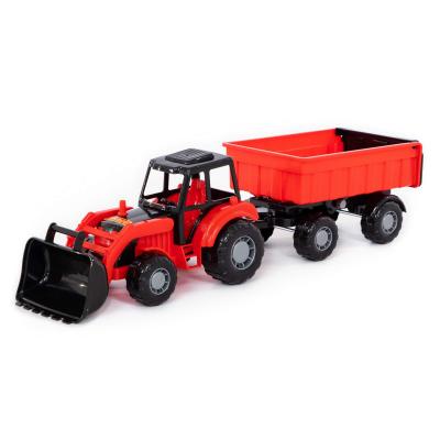 Traktor markolóval és pótkocsival